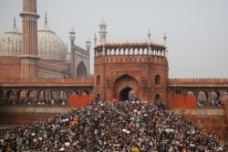 Indians gather for a protest against the Citizenship Amendment Act after Friday prayers outside Jama Masjid in New Delhi, India, Dec. 20, 2019.