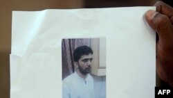 A pro-democracy protester talks on a loudspeaker to there gathered in the Mong Kok district of Hong Kong, Oct. 5, 2014.