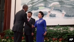 2016年9月4日,中国主席习近平和夫人彭丽媛在G20杭州峰会的欢迎晚宴前迎接美国总统奥巴马