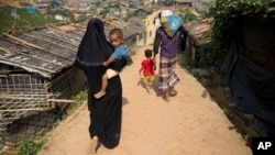 President Joe Biden and first lady Jill Biden visit the place of a shooting at a food store to pay respects and speak to families of the victims of Saturday's shooting in Buffalo, New York.