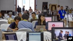 第52届东盟外长会议2019年7月30日在泰国首都曼谷举行,记者聚集在会议的媒体中心。