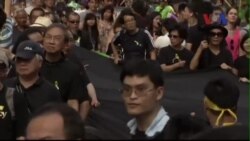 Dân Hong Kong tuần hành tố cáo Bắc Kinh thất hứa Dân Hong Kong tuần hành tố cáo Bắc Kinh thất hứa