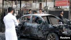 Hiện trường một vụ tấn công bằng bom xe ở Iraq, ngày 18/9/2013.