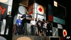 Mexico's Hector Moreno (on the ground) fights for the ball with Cameroon's Samuel Eto'o during their 2014 World Cup Group A soccer match at the Dunas arena, in Natal June 13, 2014. 