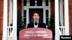 加拿大总理特鲁多3月29日举行抗疫记者会。