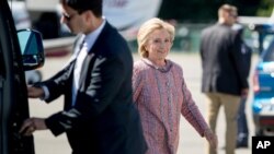 Democratic presidential candidate Hillary Clinton arrives to board her campaign plane at Westchester County Airport, in White Plains, Sept. 15, 2016, to travel to Greensboro, N.C., for a rally.