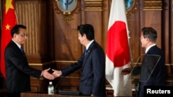 中日韩三国领导人2018年5月9日会后共同见记者(路透社)