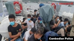 柬埔寨警方当局发布照片显示,非法入境的中国籍人士被柬埔寨警方拘留。(2021年7月26日)