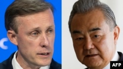 资料照:美国白宫国安顾问沙利文(左)与中共中央政治局委员、外交部长王毅