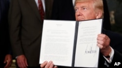 美国总统川普2017年8月14日签署备忘录,对中国进行贸易调查