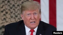 Polish President Andrzej Duda embraces Ukraine's President Volodymyr Zelenskiy during a session of Ukrainian parliament in Kyiv as Russia's attack on Ukraine continues.