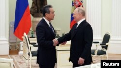 2023年2月22日,俄罗斯总统普京与中共中央政治局委员、中央外事办主任王毅在莫斯科举行会谈。