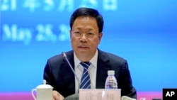 资料照：新疆维吾尔自治区政府新闻发言人徐贵相在北京举行的有关新疆问题的记者会上 （2021年5月25日）