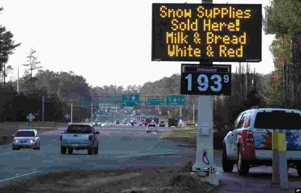 A convenience store in Raleigh, North Carolina, advertises the "essentials" as a winter storm threatens to dump the first big snow of the season, Jan. 21, 2016.