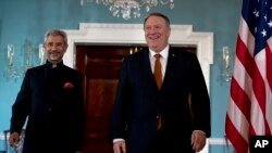 Secretary of State Mike Pompeo and Indian External Affairs Minister Dr. S. Jaishankar walk to meet the media before a bilateral meeting at the Department of State in Washington, Dec.18, 2019.