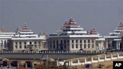Muslim Khaloar Abdarahim holds a placard which reads "Not in my name" as he poses inside the Arrahma Mosque after Friday prayers in Nantes, western France after a gathering to pay tribute to French mountain guide Herve Gourdel. Thousands of French Muslims rallied across the country to protest the Islamic State, which many say does not represent their religion.