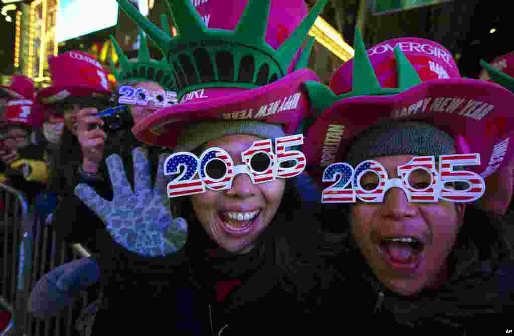 Revelers cheer in Times Square, New York, during the New Year's Eve celebration, Dec. 31, 2014.