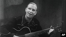 美国乡村音乐歌手欧冯.金.奥崔演唱《哦,苏珊娜!》,1936年。