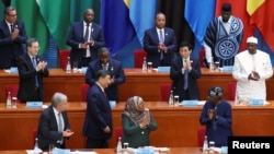 资料照片:中国国家主席习近平在北京人民大会堂出席第九届中非合作论坛峰会开幕式并发表主旨演讲后返回座位。(2024年9月5日)