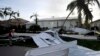 Atap-atap rumah warga berserakan diterbangkan oleh badai Irma di Marco Island, Florida, Senin (11/9). 