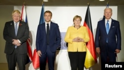 美国总统拜登、英国首相约翰逊、法国总统马克龙和德国总理默克尔在罗马举行会晤(2021年10月30日)