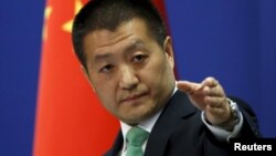 U.S. President Donald Trump talks with Japan's Emperor Akihito while his wife Melania talks with Empress Michiko at the Imperial Palace in Tokyo.