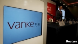 资料照:中国房地产巨头万科集团董事会主席郁亮在香港出席一个记者会。(2016年3月14日)