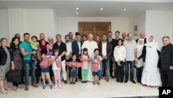Pope Francis poses with a group of Syrian refugees at the Vatican, Aug. 11, 2016.
