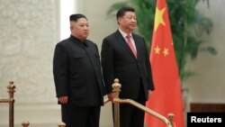 中国国家主席习近平在北京与朝鲜领导人金正恩见面。(2019年1月10日朝鲜朝中社发布)