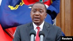 FILE - Kenyan President Uhuru Kenyatta, addresses a news conference at the State House in Nairobi, Dec. 2, 2014.