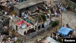 Britain's Prince Harry and Meghan, Duchess of Sussex, during a photocall with their newborn son, Archie, in St. George's Hall at Windsor Castle, Windsor, England.
