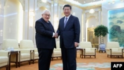 中国国家主席习近平2015年3月在北京会见前美国国务卿亨利·基辛格。(法新社)