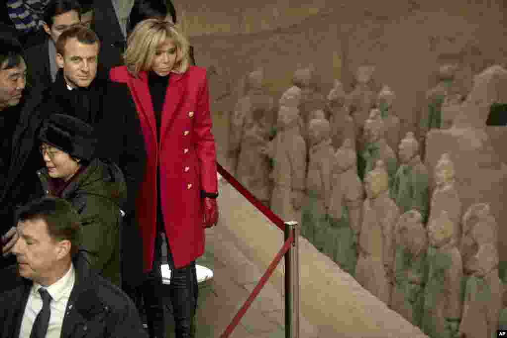 A woman wearing a protective face mask joins former British armed forces members and supporters at a "Respect Our Veterans" parade and rally in London, May 8, 2021.