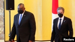 美国国务卿布林肯(右)与防长奥斯汀2021年3月16日在东京与日本外相和防卫相举行会谈(路透社)
