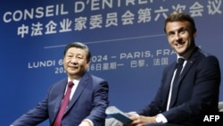 中国国家主席习近平与法国总统马克龙2024年5月6日在巴黎与法国工商界人士会面。(法新社)