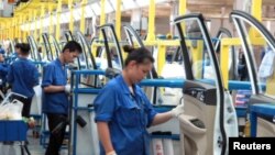 Boys dressed in white depicting holy cows participate in a parade to mark Gaijatra Festival, also known as the festival of cows, in Kathmandu, Nepal.