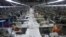 Employees work at the Shweyi Zabe garment factory i