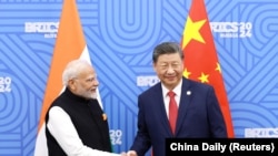 中国领导人习近平与印度总理莫迪在俄罗斯喀山出席金砖国家峰会期间举行会晤。在中国外交部副部长孙卫东和印度外秘唐勇胜结束于北京举行的副外长/外秘级对话之后,双方就一系列改善中印关系的举措达成具体共识(2024年10月23日)