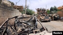 Thành viên của lực lượng phản ứng nhanh Iraq trên quân xa trong một trận chiến chống IS ở Mosul, Iraq, 20/5/2017.